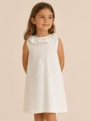 Niña con vestido modelo SOL Léemba Kids